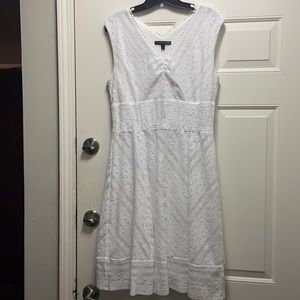 White lace type sleeveless dress with v cut neckline